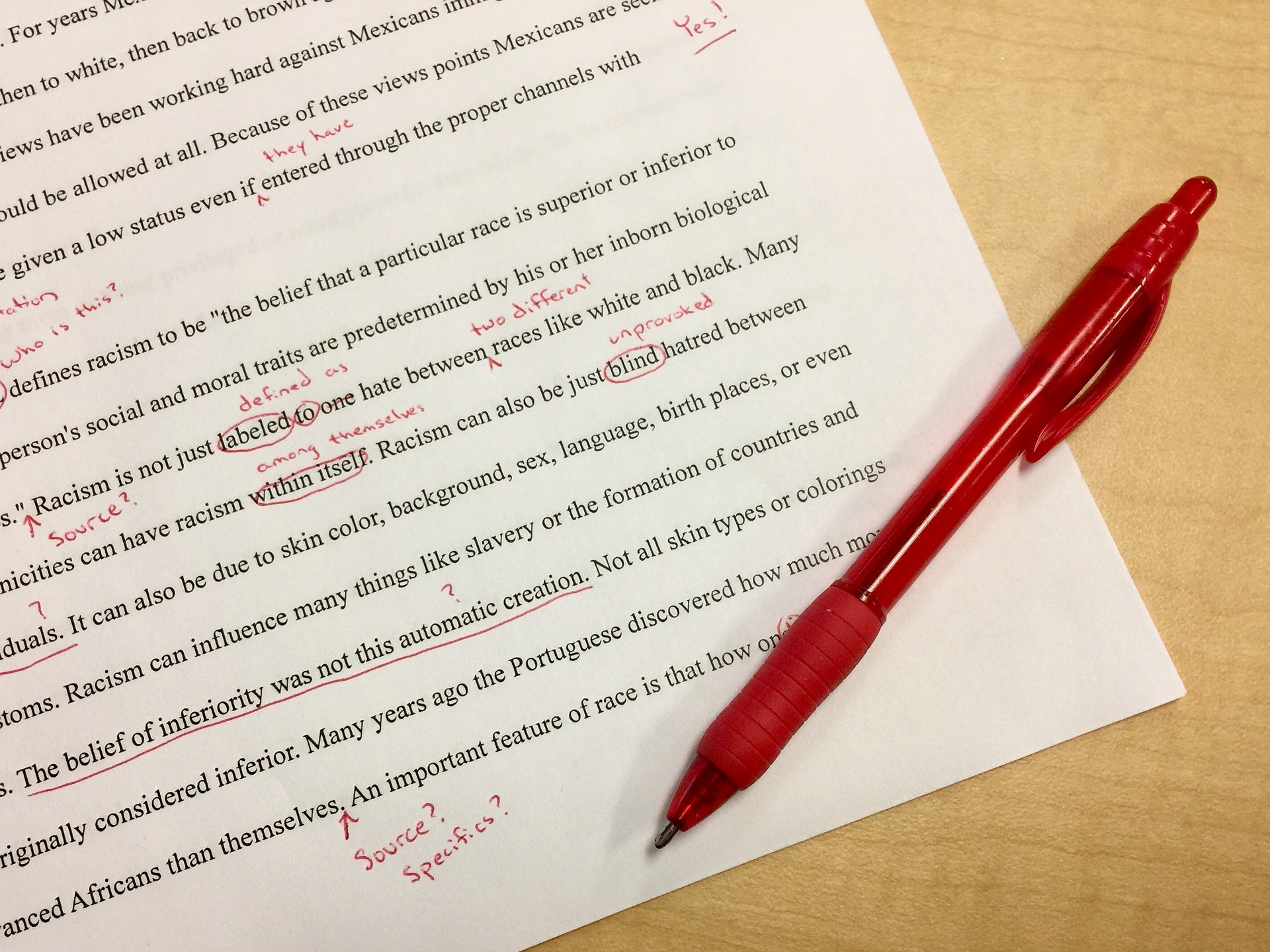Essay with red pen markings